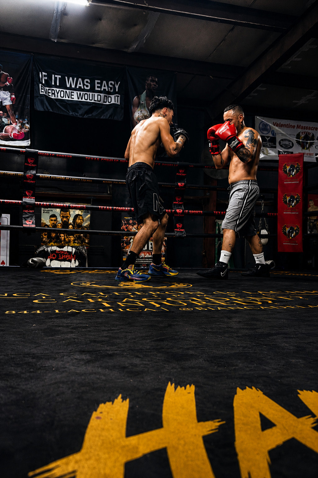 Andrew Zamarripas, gloves up at his chin, squared up to a sparring partner in the ring ahead of his exhibition bout